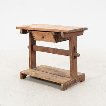 A wooden bench/sideboard from the first half of the 20th century.