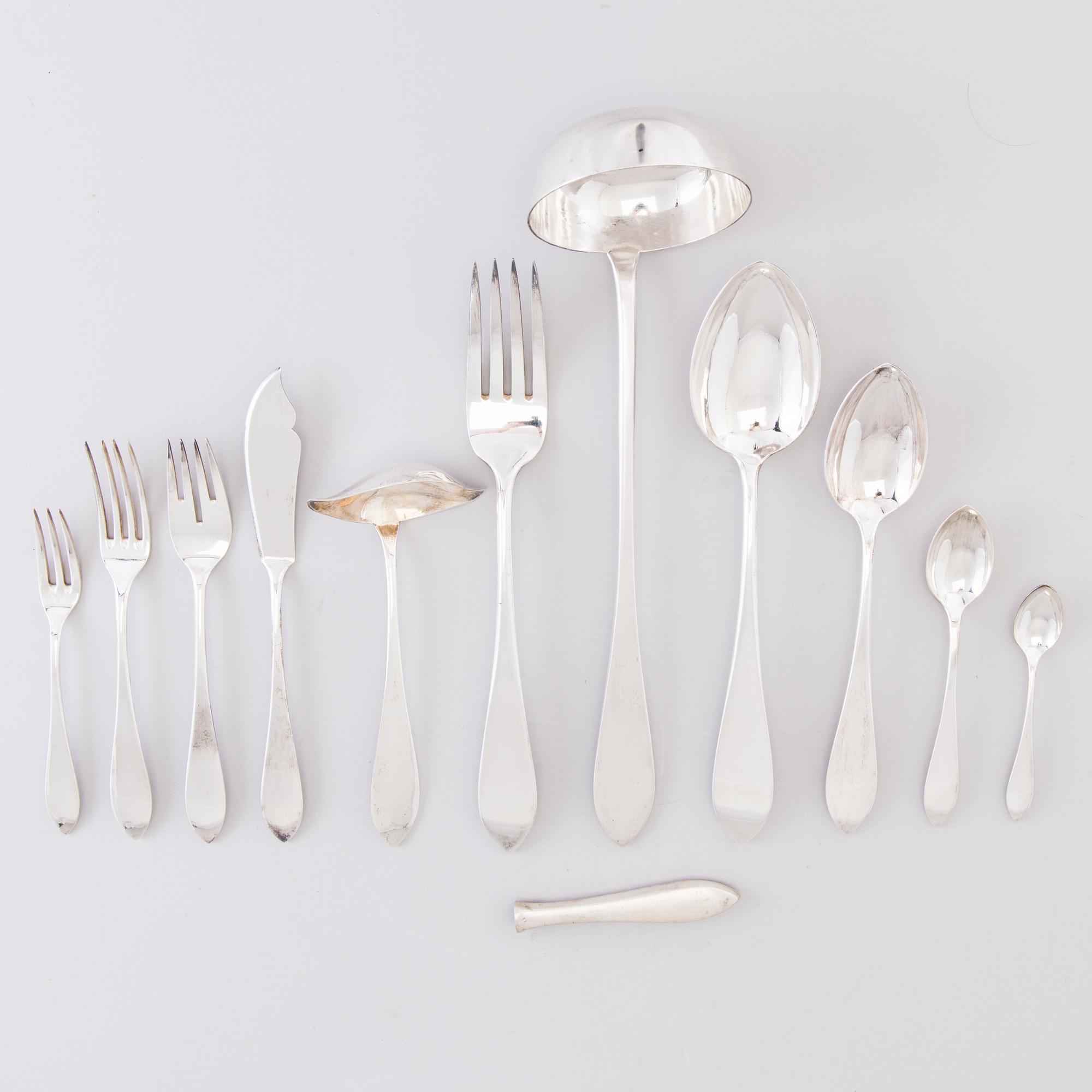A 1920s 88-piece set of silver cutlery and 12 knife handles, Warsaw Poland.