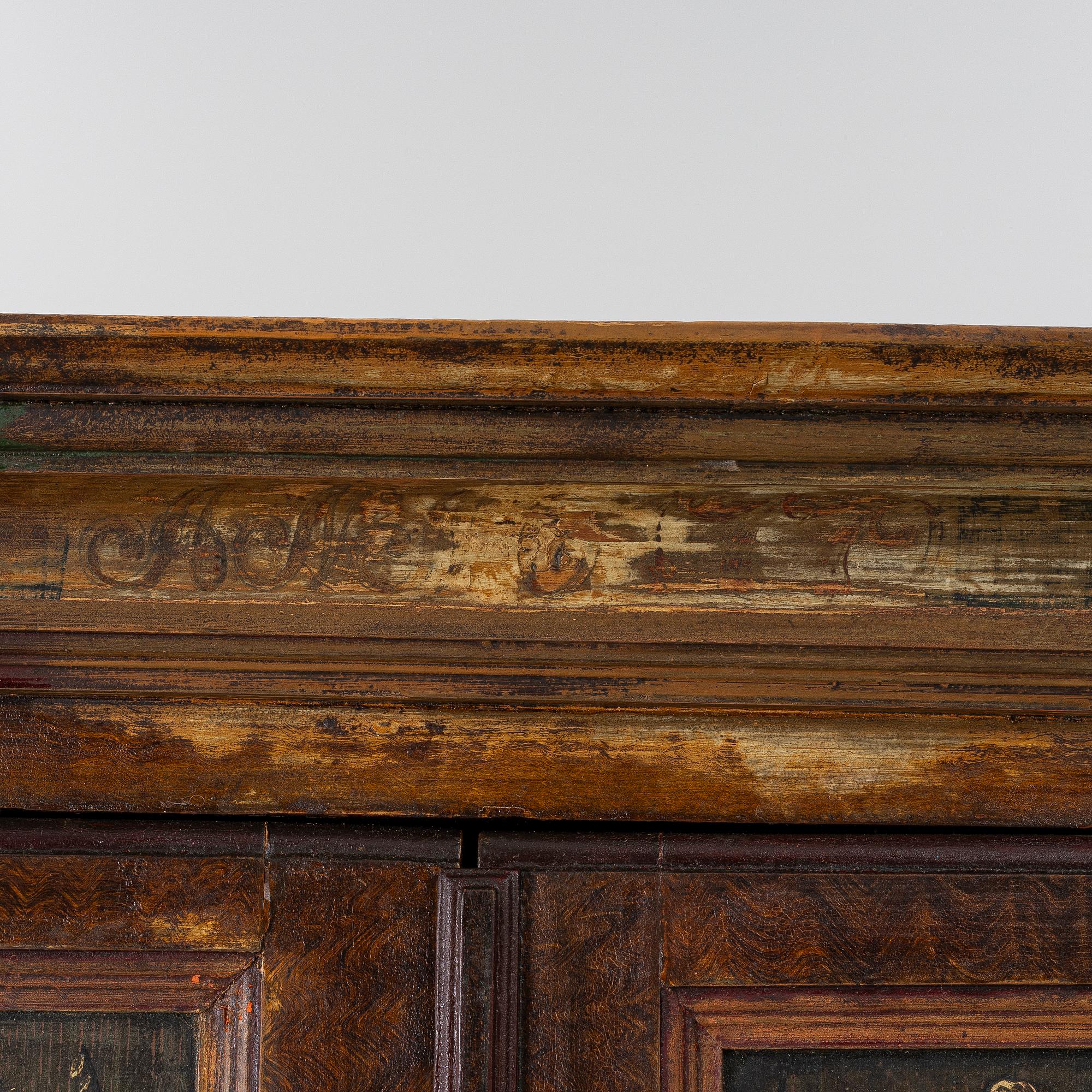A corner cupboard, dated 1779.