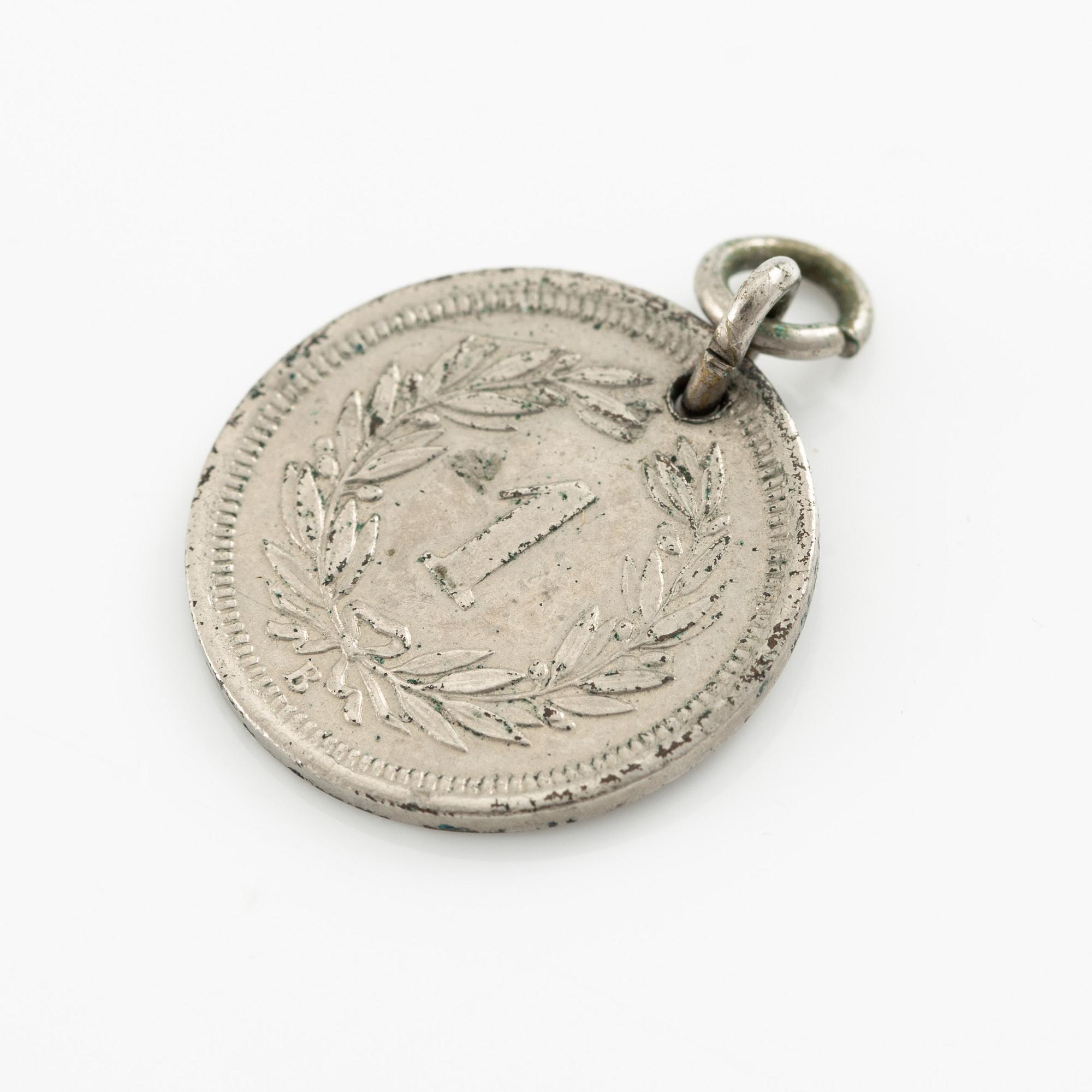 Two bracelets, a brooch, and a pendant with coins.