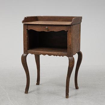 A mid 18th Century oak rococo bedside table.