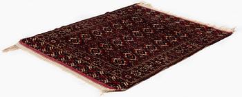 An antique Yomut rug, Western Turkmenistan, c. 119 x 104 cm.