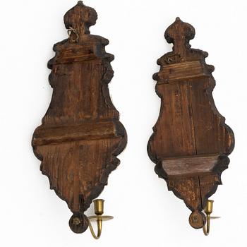 A pair of Nort European late baroque one-light girandole mirrors, mid 18th century.