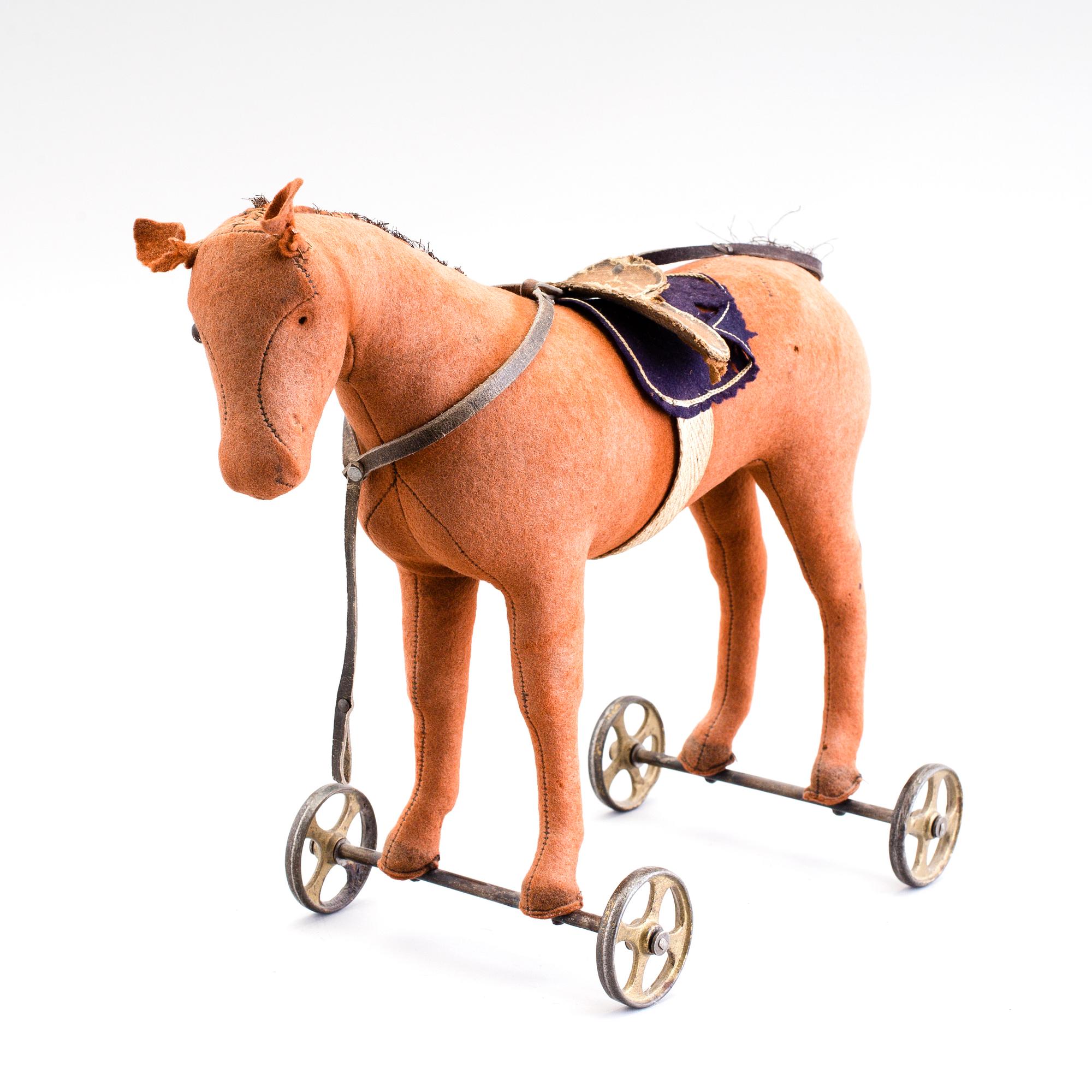 A horse on wheels probably by Steiff 1910.