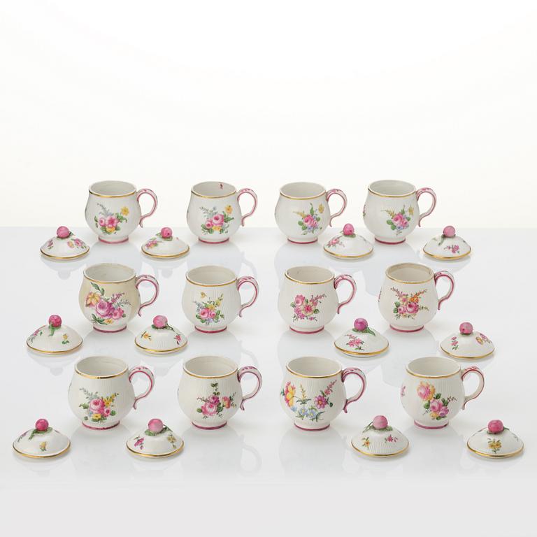 A set of 12 Swedish Marieberg soft paste custard cups with covers, 18th century.