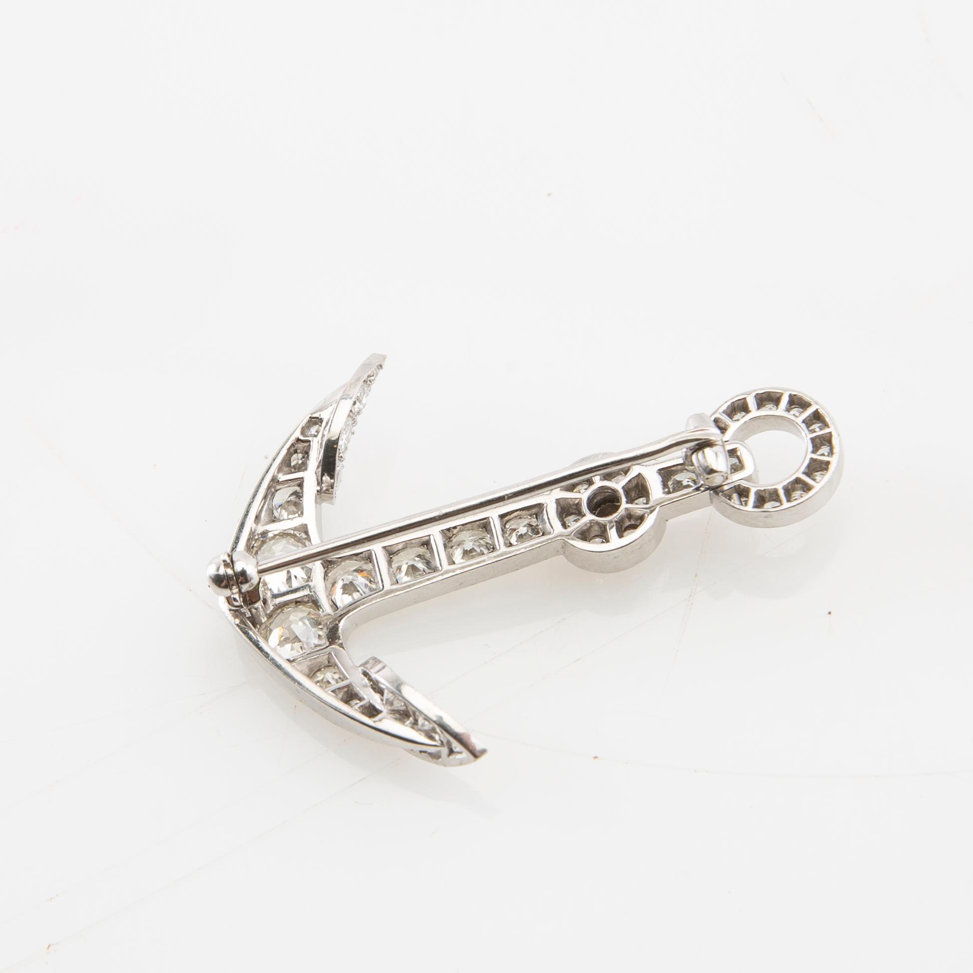 Brooch in the form of an anchor made of 18K white gold with diamonds.