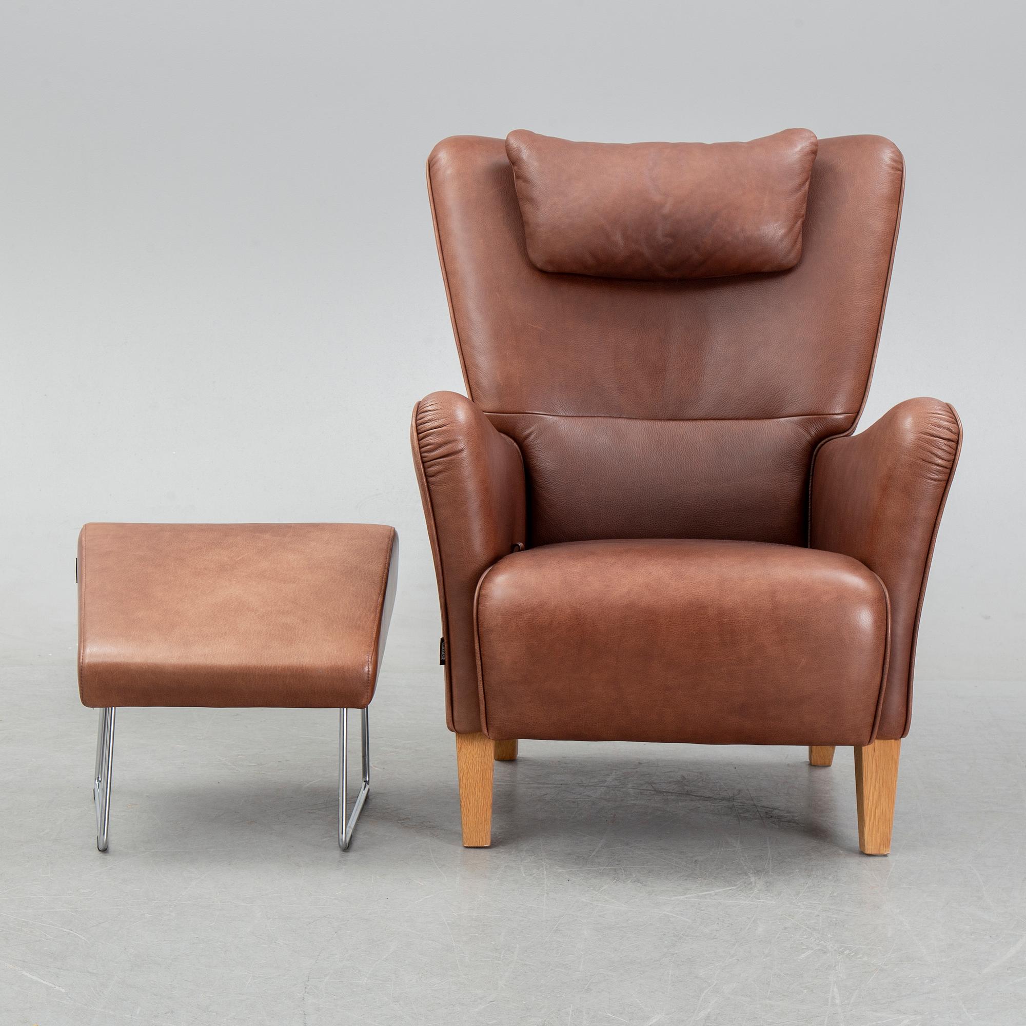 A 'Stepp' easy chair width stool by Carl-Henric Spak for Swedese.