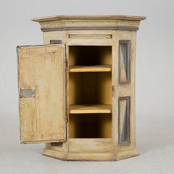 A 18th century corner cabinet.