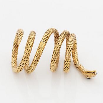 An 18K gold snake bracelet.