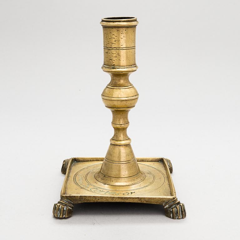 A late 17th century Spanish brass candlestick.