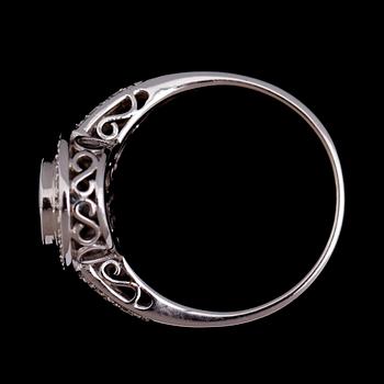 RING, 14 k vitguld, ljusblå topas, briljantslipade diamanter tot ca 0.12 ct.