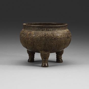 438. A bronze tripod censer, presumably Ming dynasty.