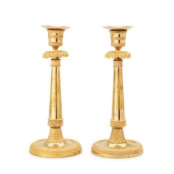 519. A pair of late Gustavian circa 1800 gilt bronze candlesticks.
