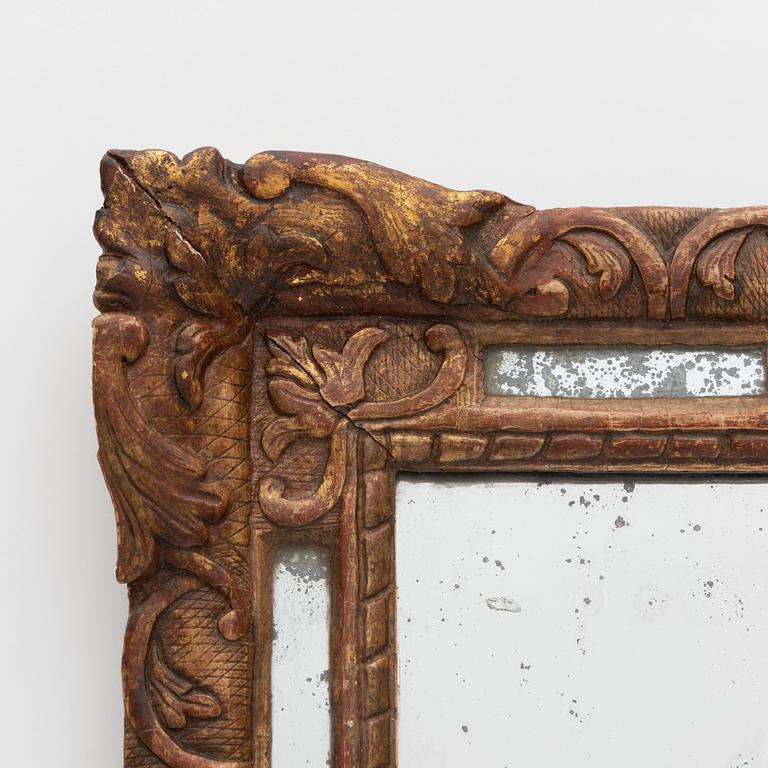 A Baroque mirror, France, 18th Century.