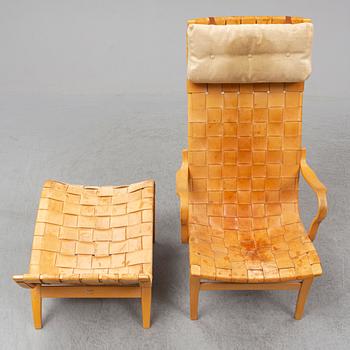 BRUNO MATHSSON, an easy chair and ottoman, Firma Karl Mathsson, Värnamo, 1978.