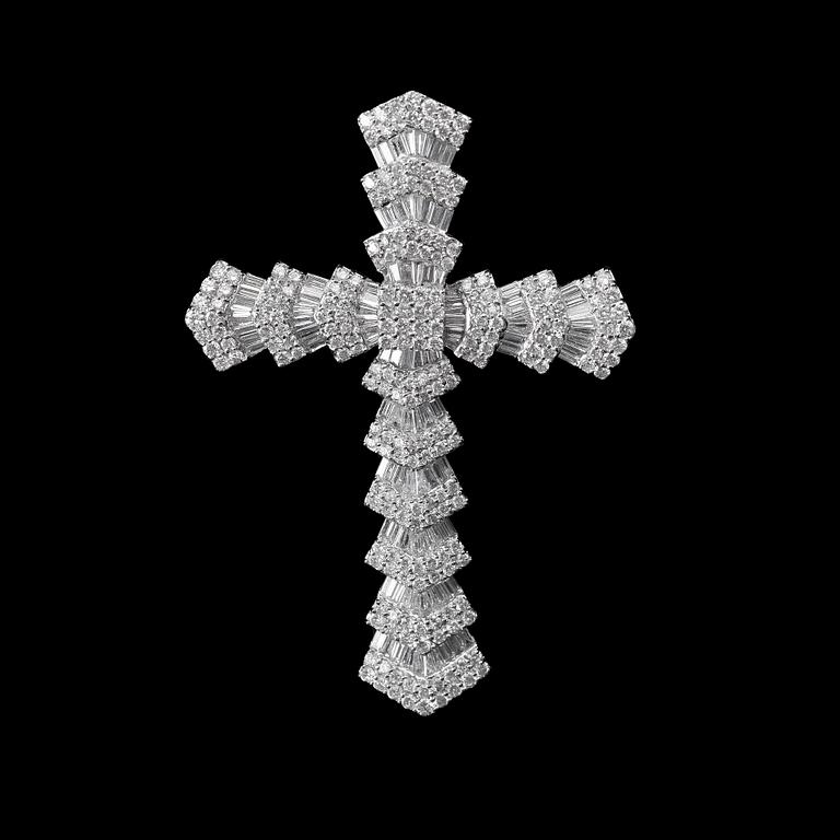 A CROSS,  brilliant and baguette cut diamonds c. 6.50 ct. Weight 14,3 g.