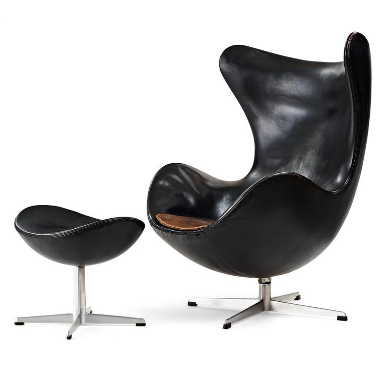 ARNE JACOBSEN, a black leather "Egg" chair with ottoman, Fritz Hansen, Denmark 1960's.