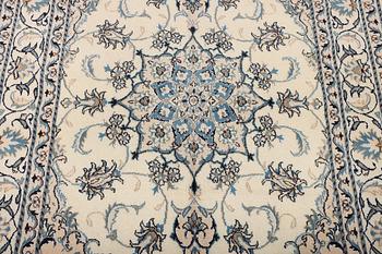 A Nain part silk rug, c. 193 x 148 cm.