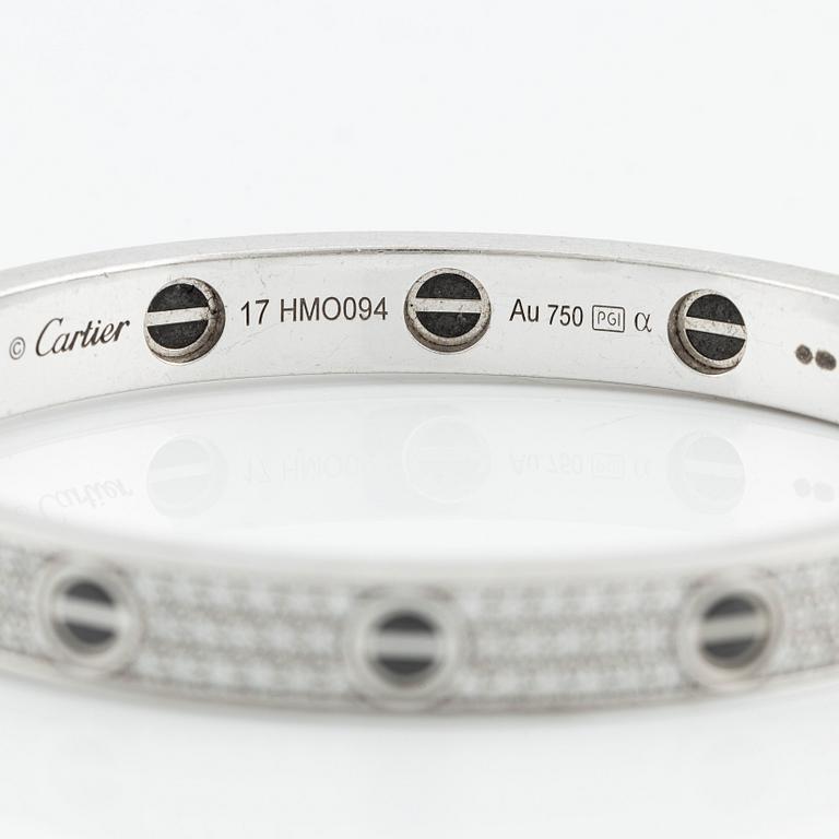 An 18K white gold Cartier bracelet "Love" with round brilliant-cut diamonds and ceramic.