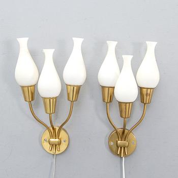 A pair of 1950s brass wall lamps.