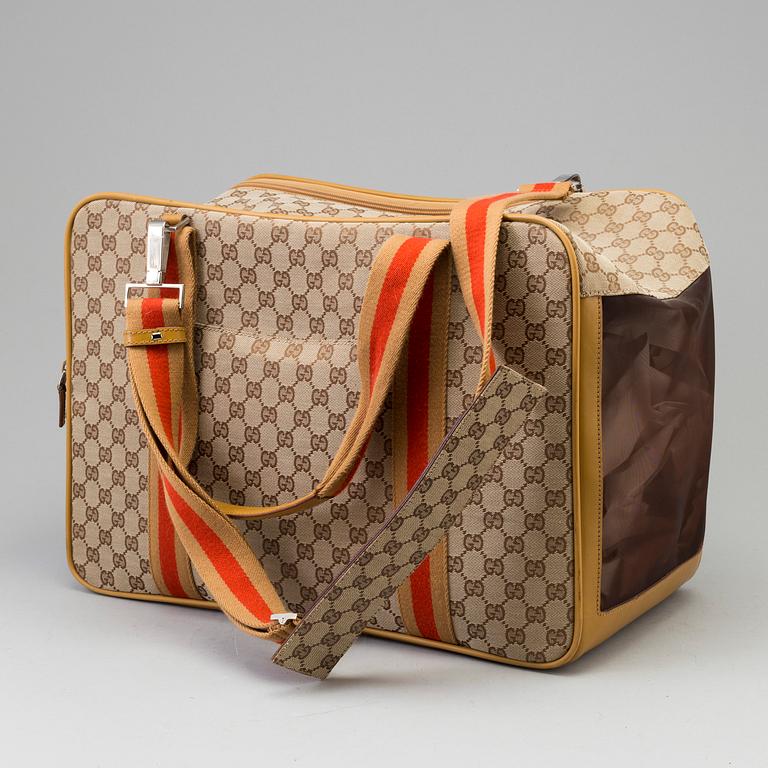 GUCCI, a monogram canvas dog bag.