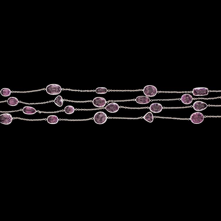 A long white gold and kunzite necklace.