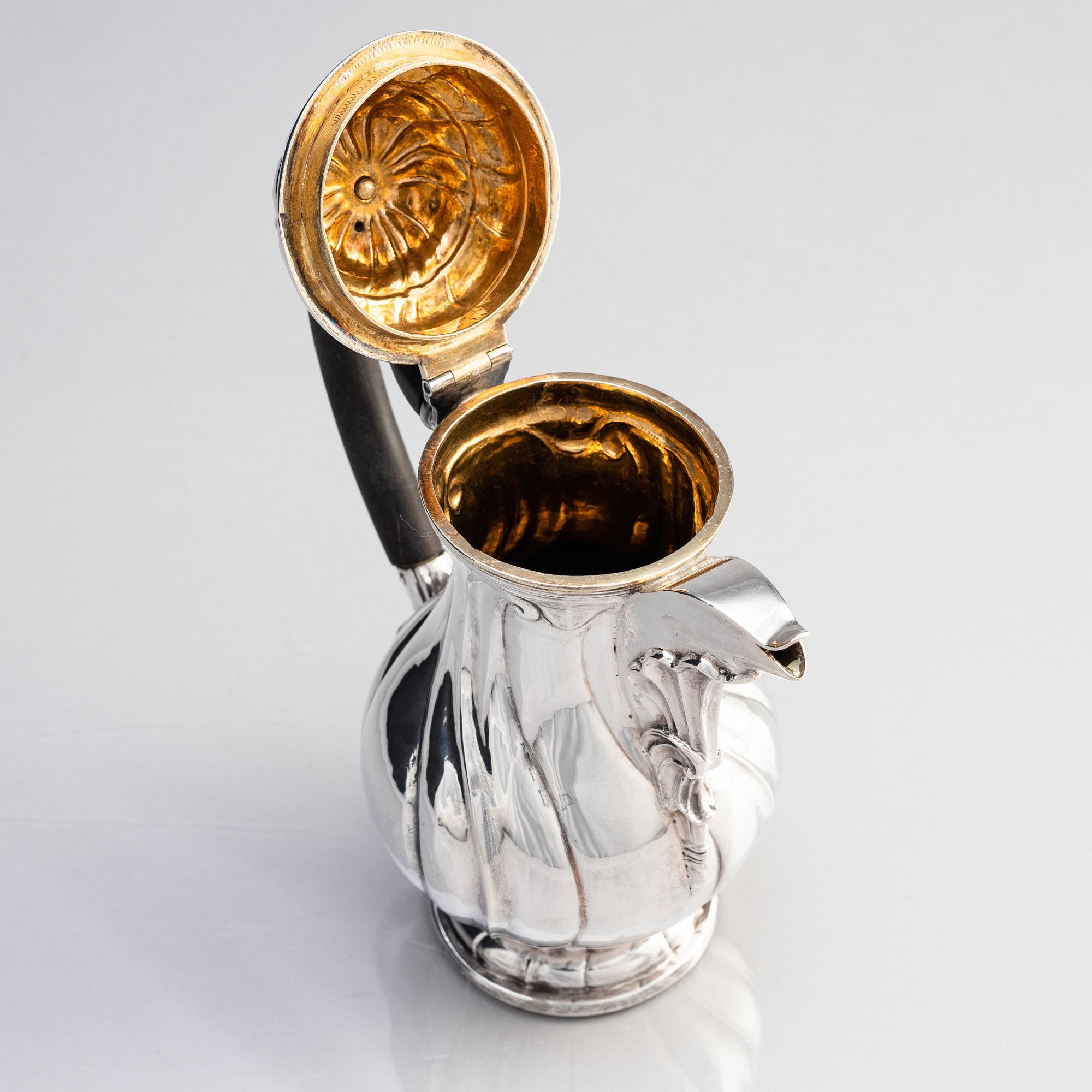 An 18th century silver coffee pot, mark of Carl Gustaf Hellmuth, St Petersburg 1770.