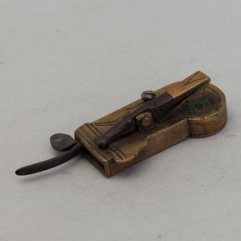 A brass and iron phleam dated 19th century.
