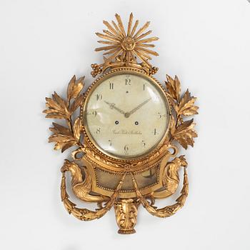 A late Gustavian carved and giltwood cartel clock by J. Kock (royal watchmaker, active 1762-1803).