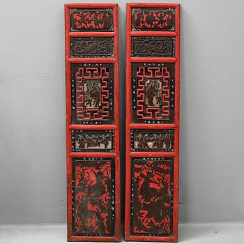 A pair of Chinese red lacquered wooden panels, 20th century.