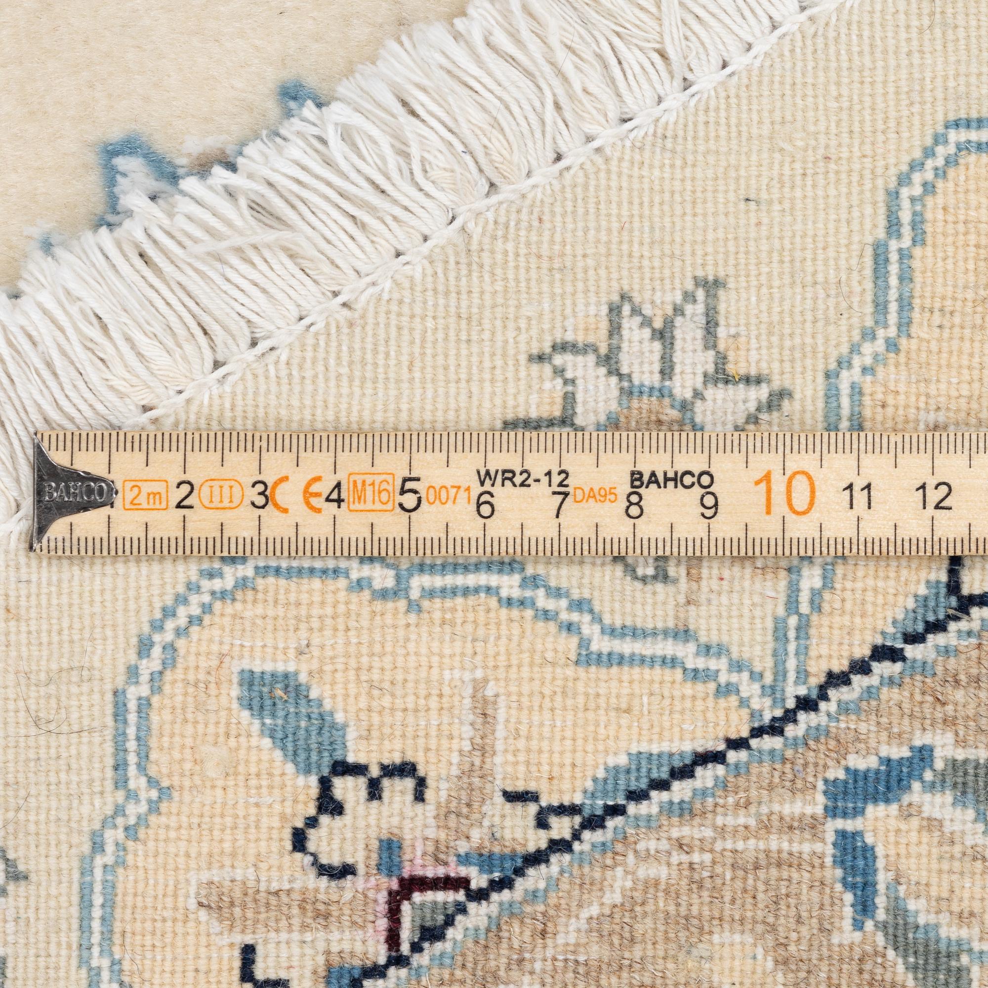 A Nain rug, diameter a. 247 cm.