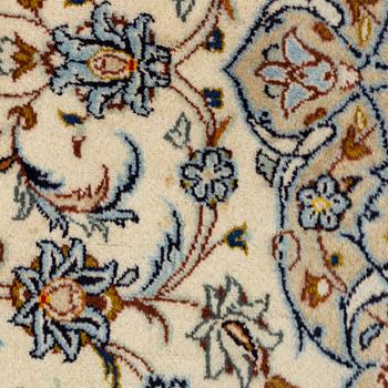 A Keschan carpet, signed, c. 350 x 245 cm.