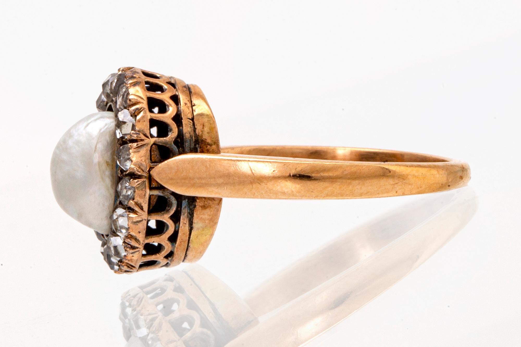Ring 14K guld med 1 pärla ca 7 mm och rosenstenar.