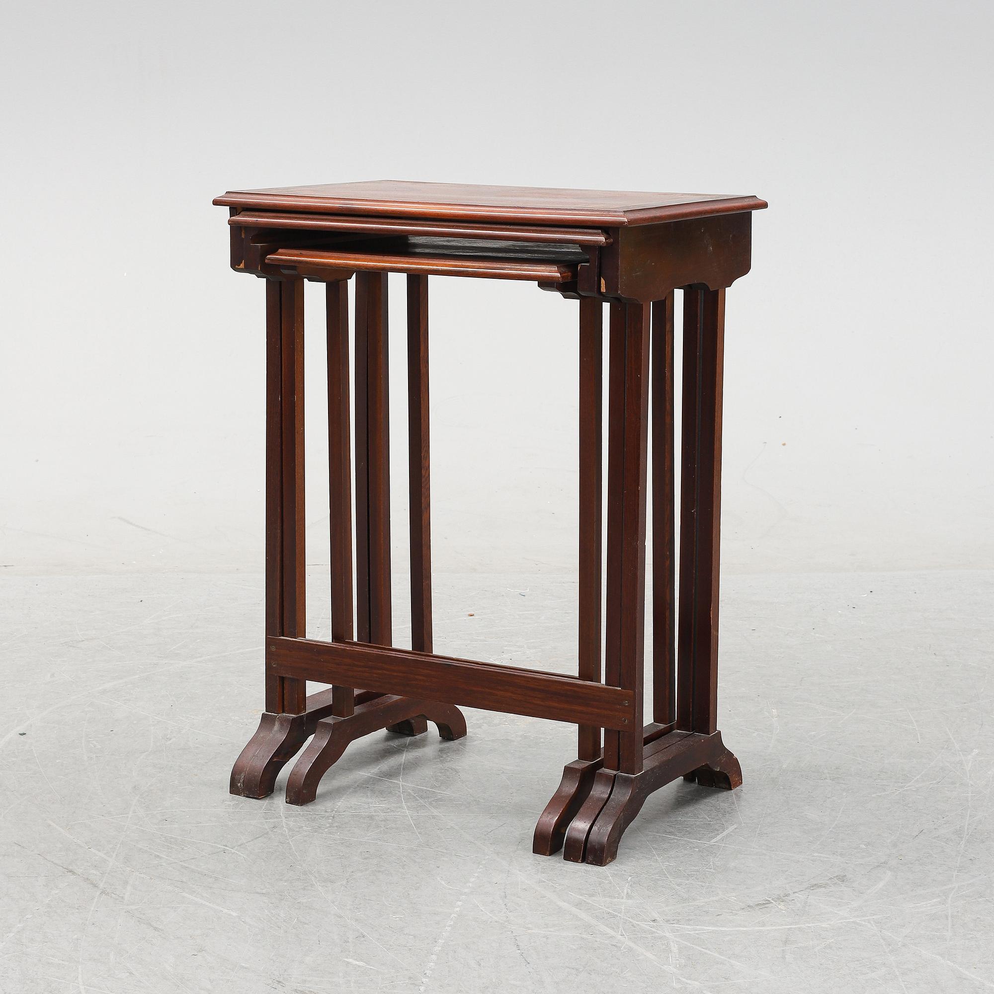 A three piece nesting table with inlay, first half of the 20th Century.