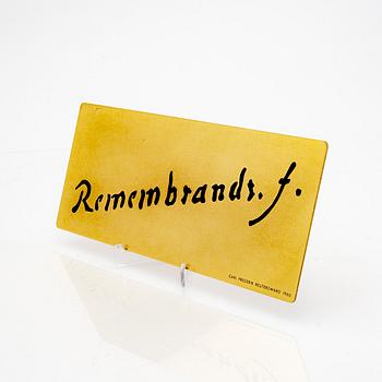 A brass multipel by Carl Fredrik Reuterswärd, signed in the plate 7/99.