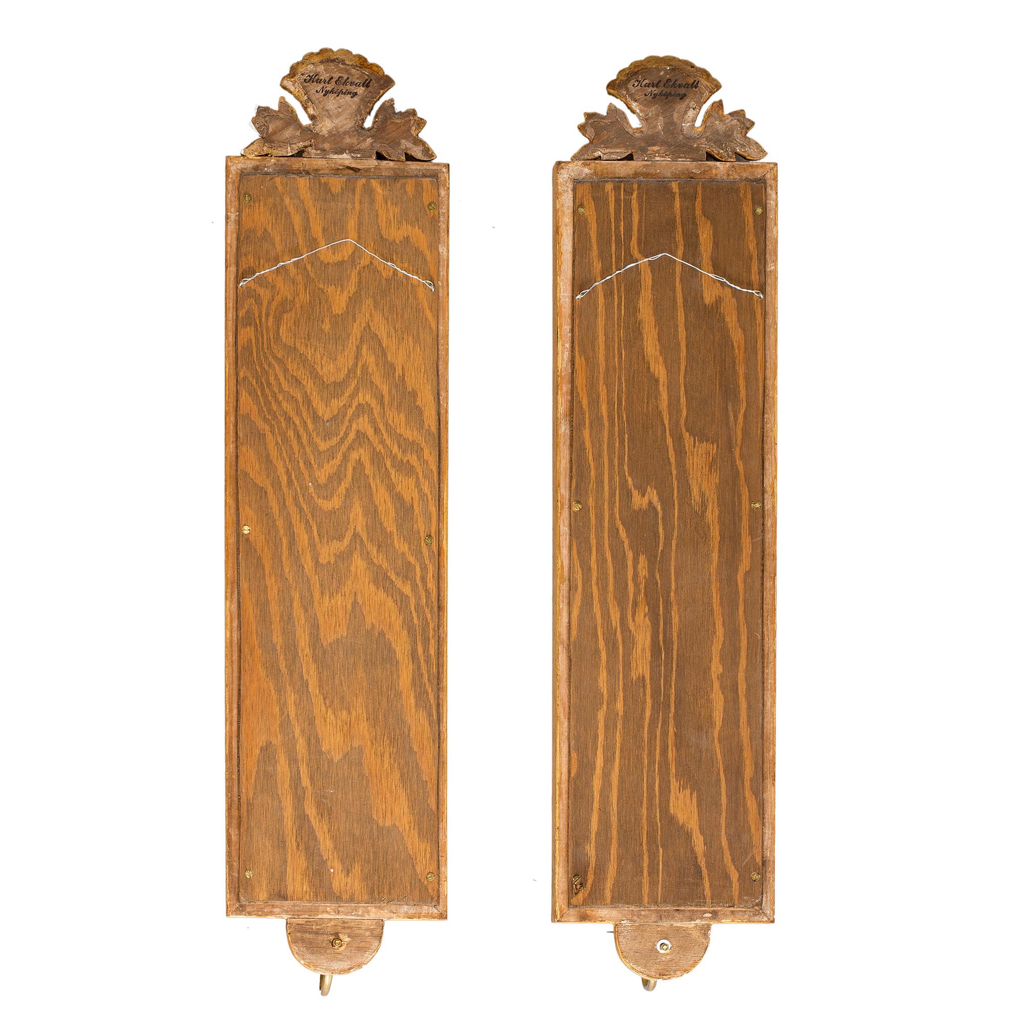 A pair of Swedish mid 20th century Gustavian style wall sconces from Kurt Ekvall in Nyköping.