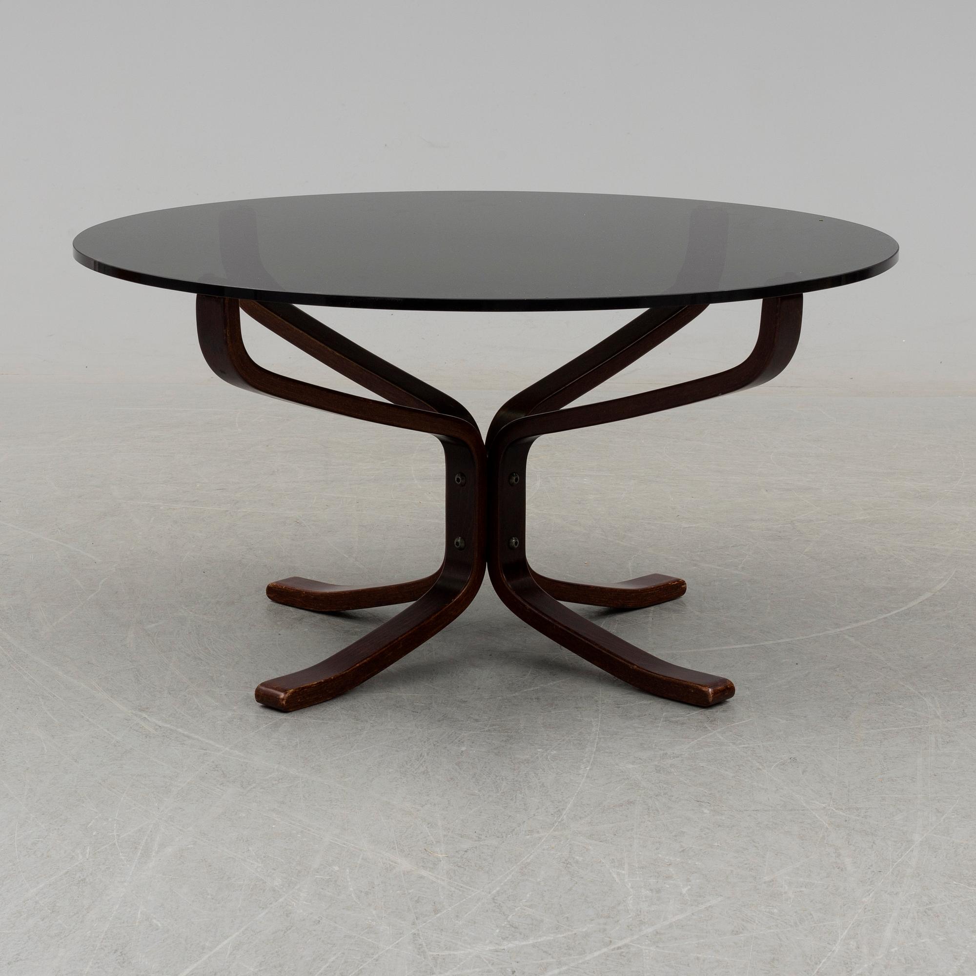 A pair of easy chairs and a table by Sigurd Ressel.