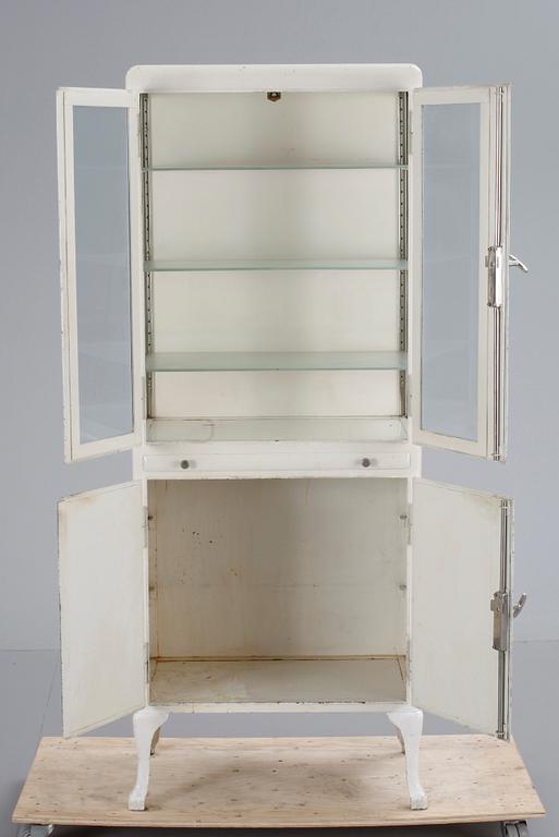 A cupboard  from a doctors practise, 20th century.