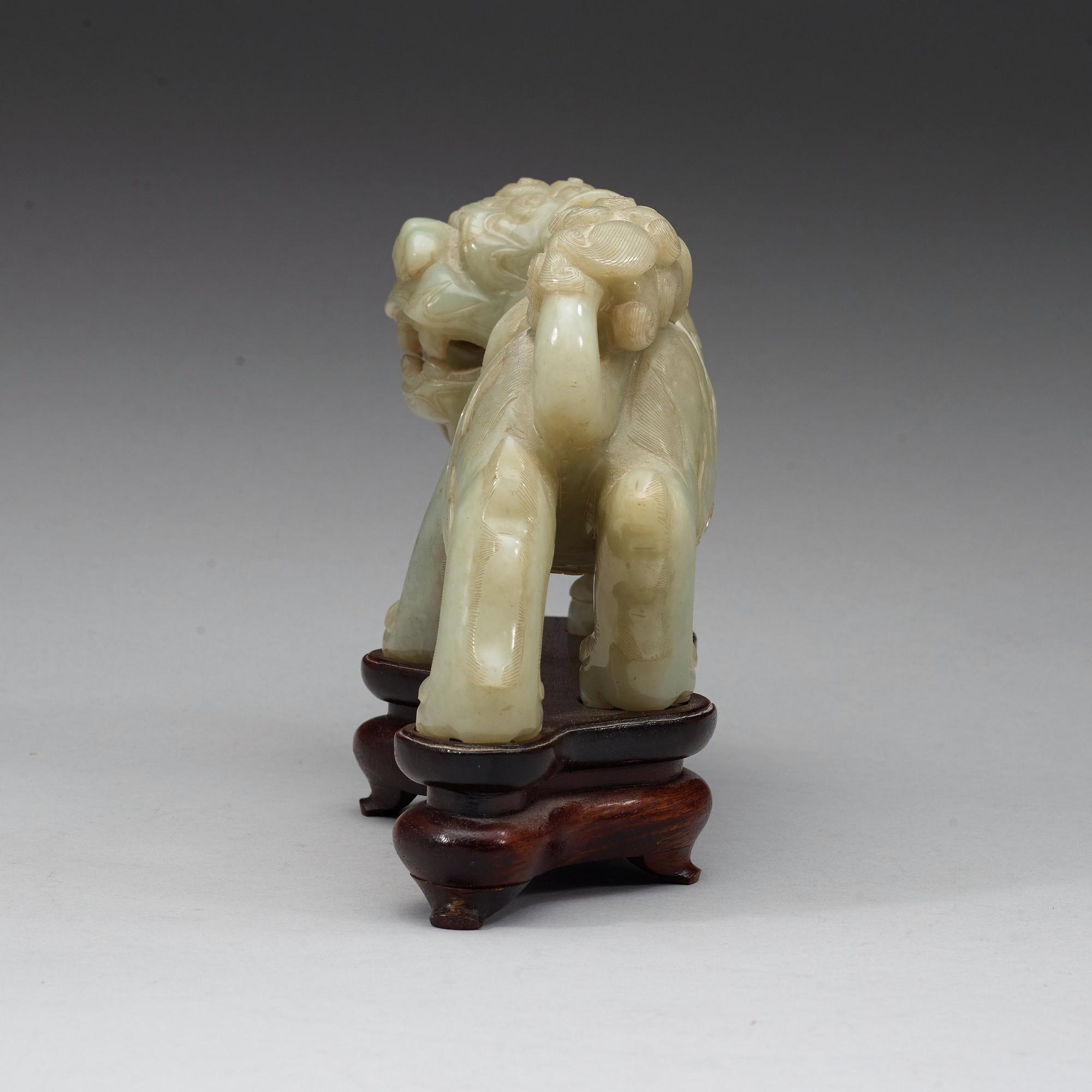 A green nephrite mytological lion, 20th century.