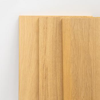 A 'String' shelving system by Nils Strinning, with three sides and 12 shelves.