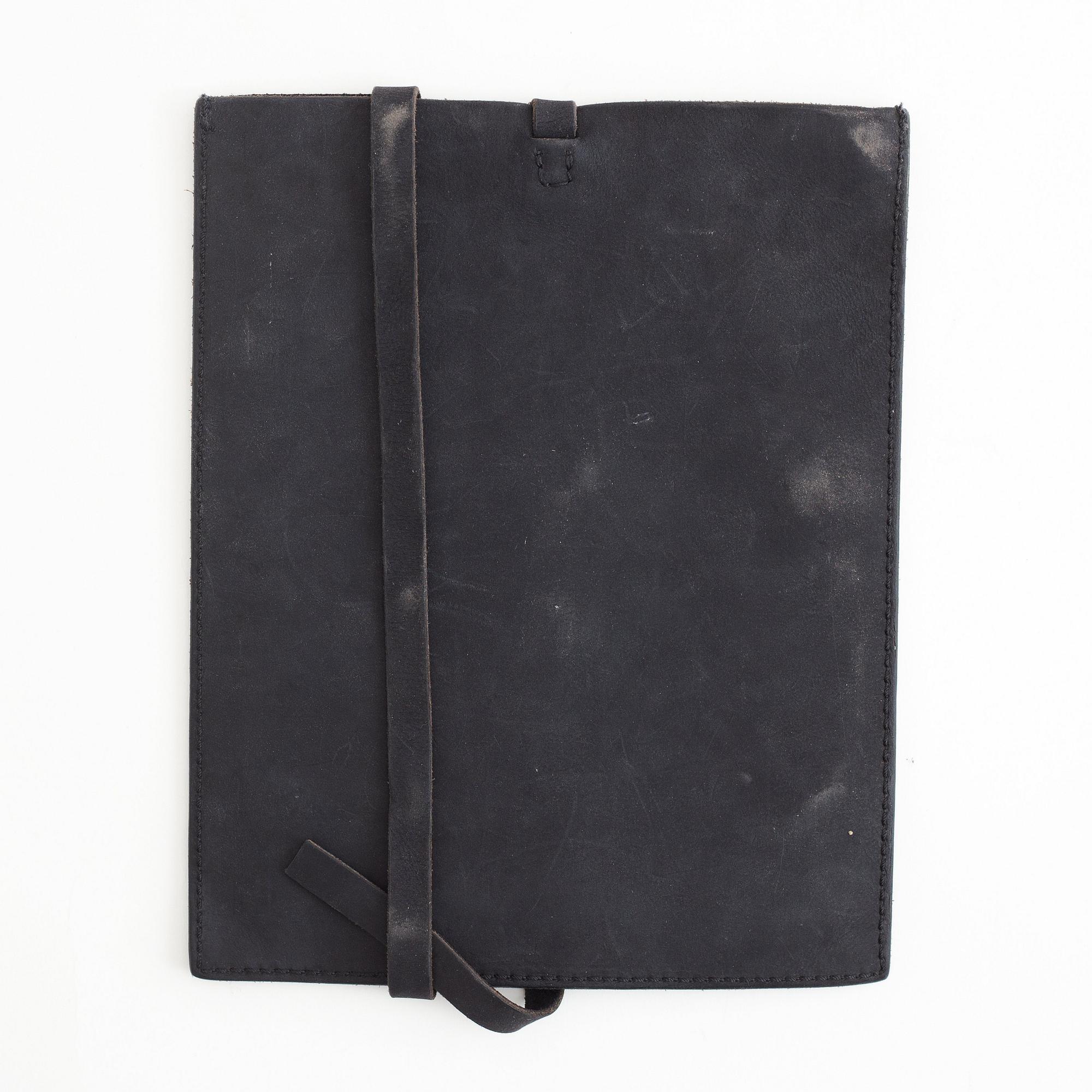 A pair of Uma Wang + Rigards, 'The Victorian', sunglasses and a Uma Wang, ipad case.