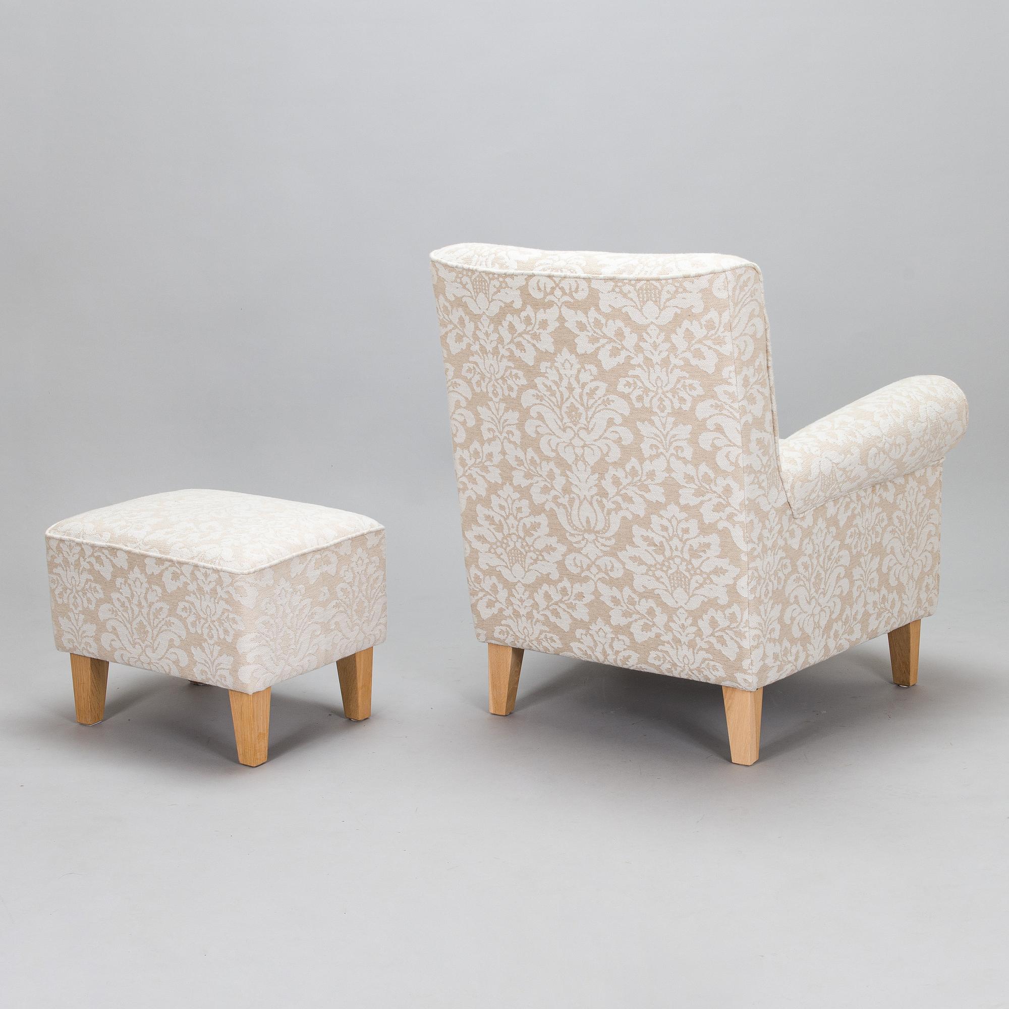 A mid-20th-century armchair and ottoman.