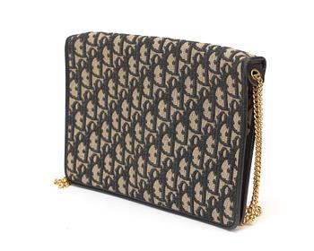 A black monogram canvas evening bag by Christian Dior.