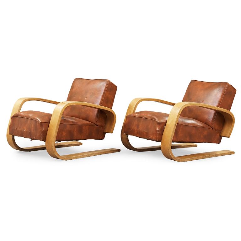 Alvar Aalto, a pair of 'tank chairs' model 400, Huonekalu-ja Rakennustyötehdas Oy for Artek, Finland 1940's-50's.