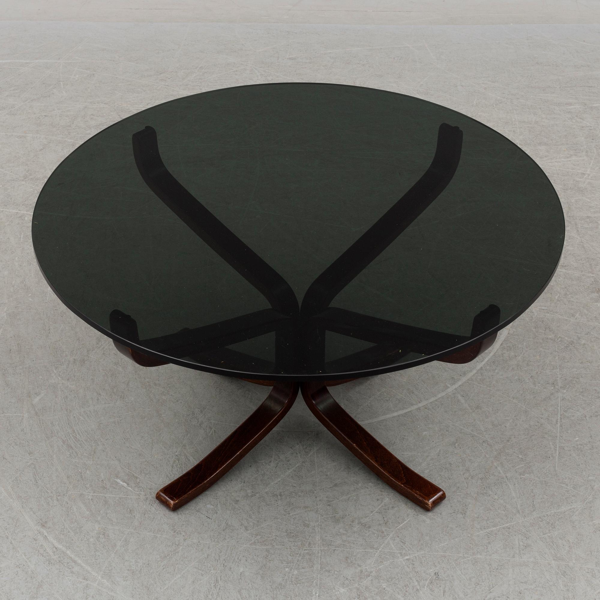 A pair of easy chairs and a table by Sigurd Ressel.