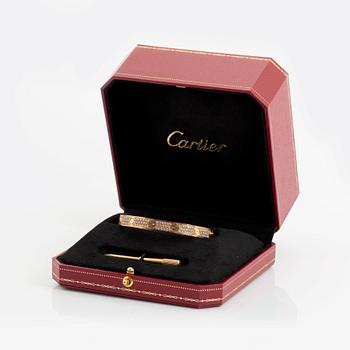 A Cartier bracelet "Love" in 18K rose gold set with round brilliant-cut diamonds.