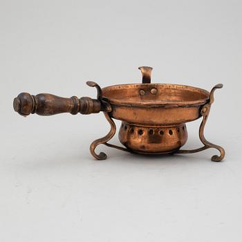 An 18th century copper firepan.