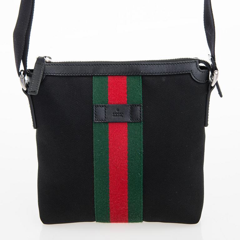 Gucci, a "Techno Canvas Web Messenger" bag.