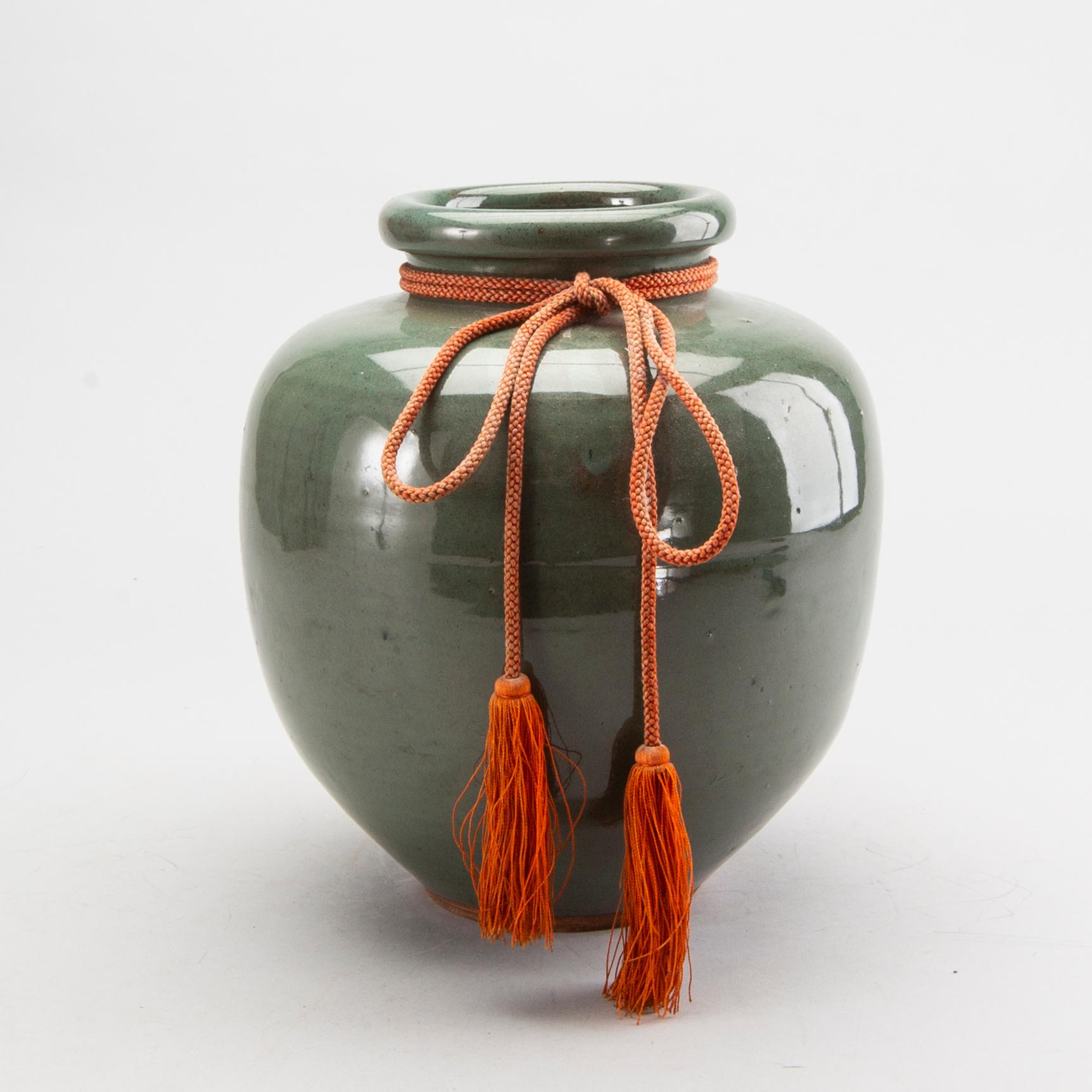 A Japanese eraly 20th century stoneware jar.