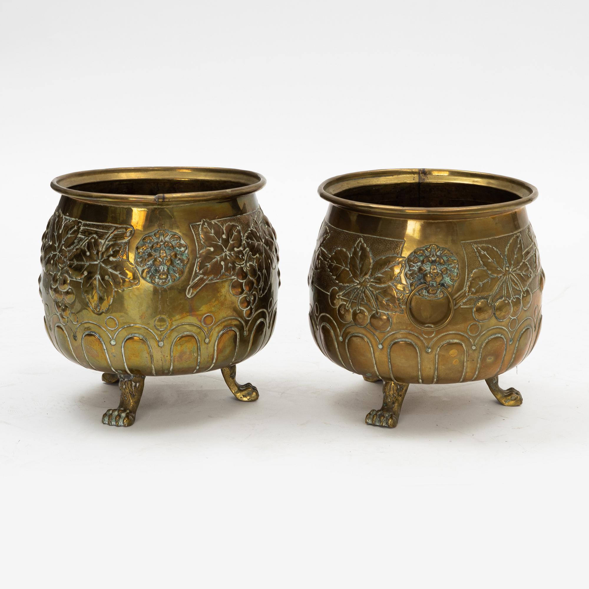 A pair of Baroque style brass plant pots, late 19th Century.